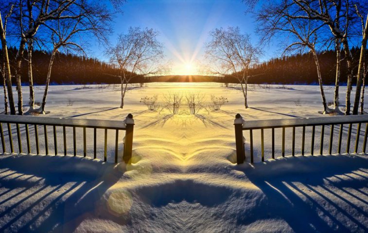 Vinterlandskap i solnedgång